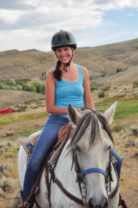 Blue Tank Top on a White Horse
